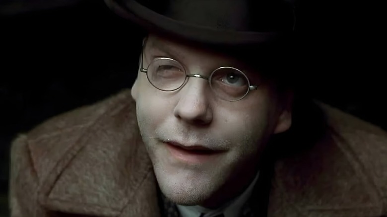 Dr. Daniel P. Schreber (Kiefer Sutherland) smiling and looking up in 