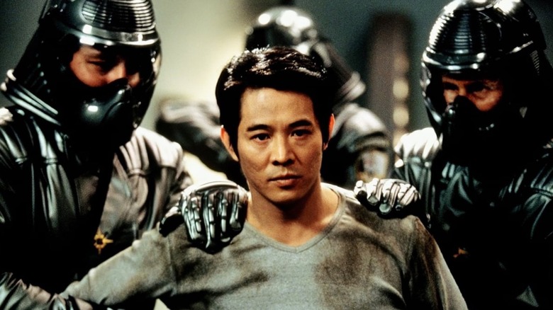 Jet Li being restrained by guards in The One