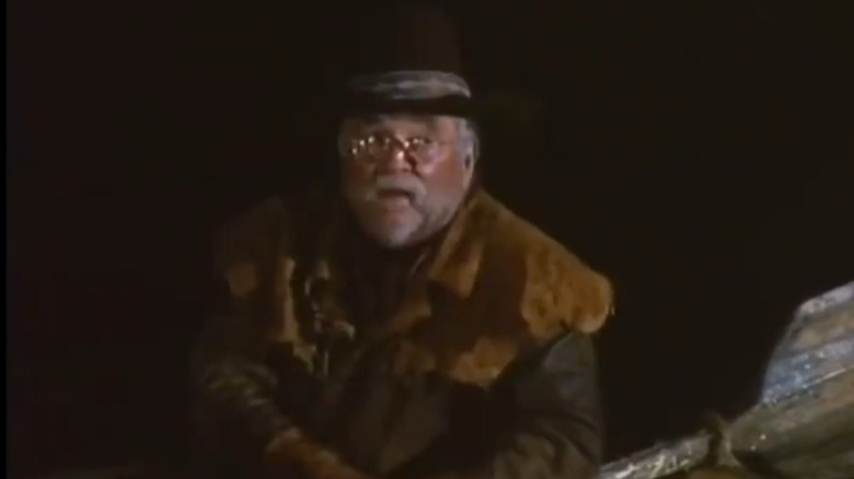 Winston Patrick Culler (Wimford Brimley) sitting down in "Blood River."