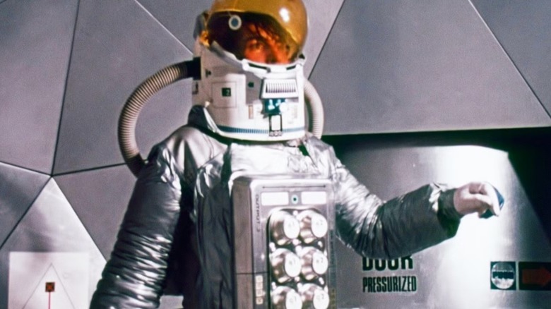 Talby (Dre Pahich) wearing a spacesuit in 