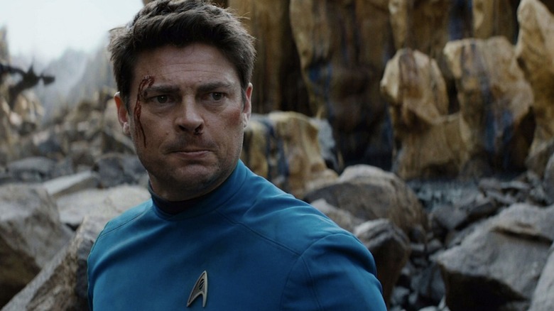 Karl Urban as Henry McCoy with a cut head in Star Trek Beyond