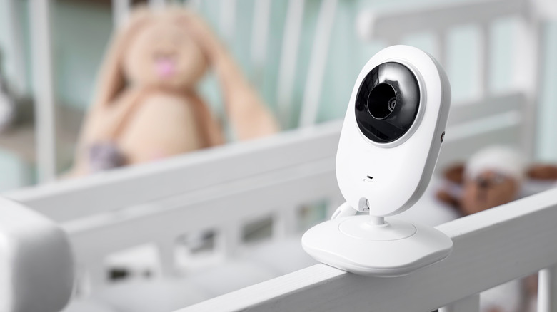 A baby monitor placed on a crib
