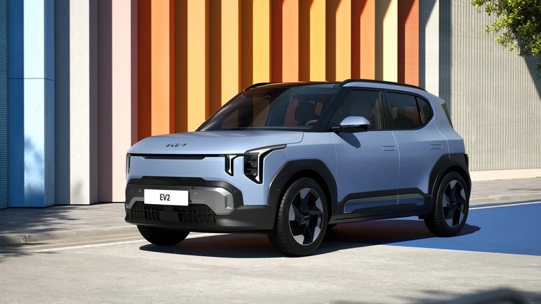 Kia EV2 featured image with modern home in background.