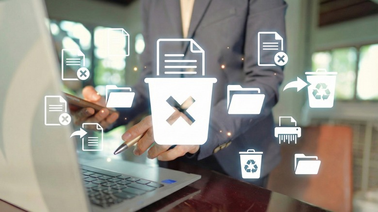 Concept image showing deletion of trash and apps on a laptop