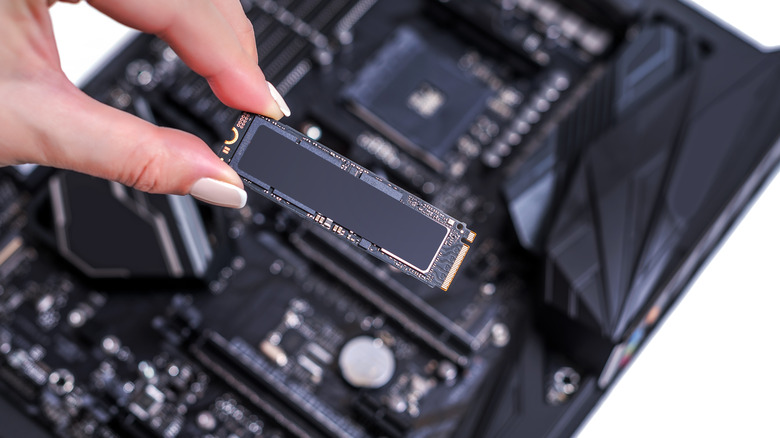 Person holding an M.2 SSD stick