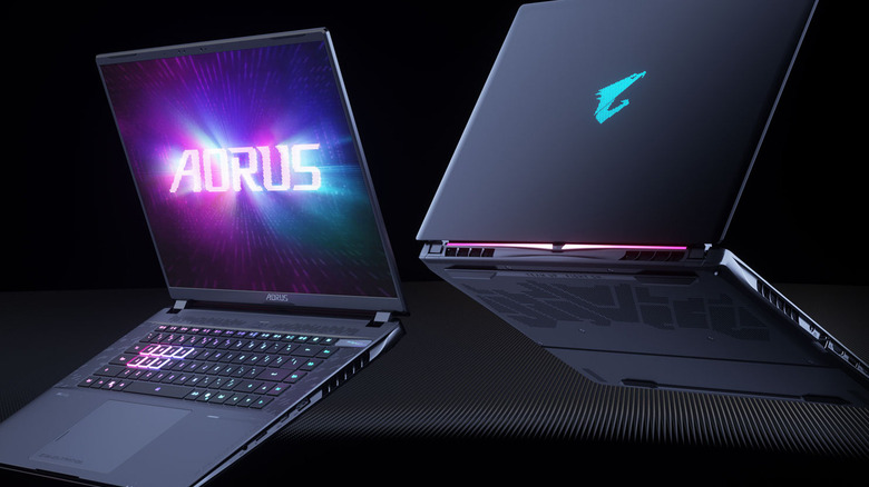 Gigabyte Aorus Master 16 AM6J front and rear view on a black gradient background