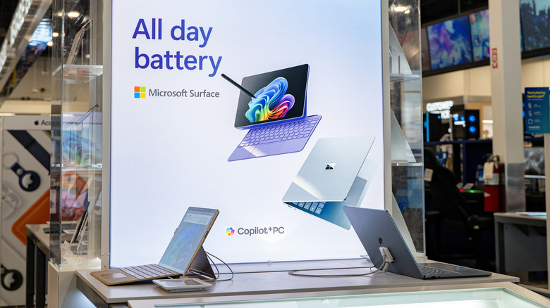 A Microsoft store display promoting the Surface laptop, an advert says "All day battery."