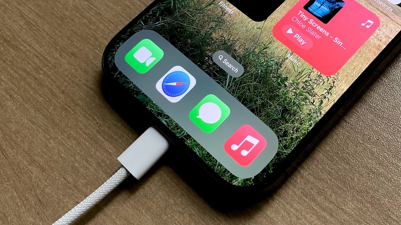 iPhone being charged with a cable