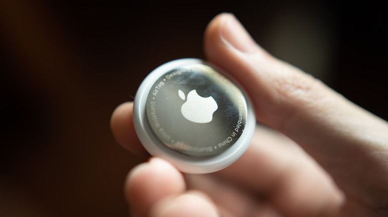 Apple's AirTag in hand