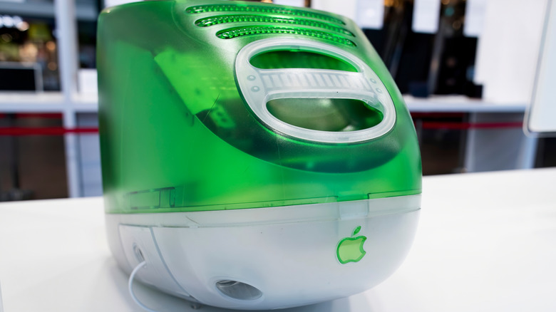 Rear view of an Apple iMac G3 monitor with the logo visible, in green.
