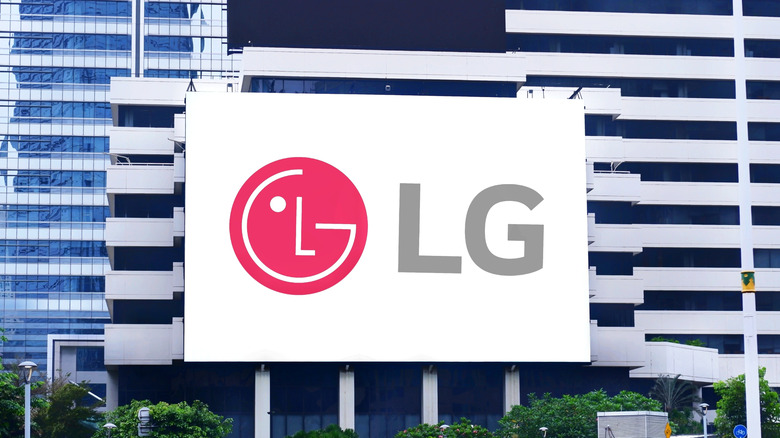 An image of the LG logo outside of a large, grey commercial building, the logo appears to be superimposed