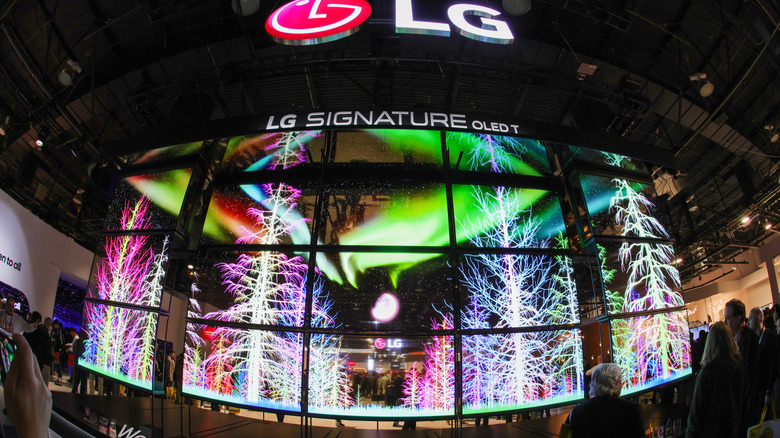 A wall display of LG OLED televisions at an event