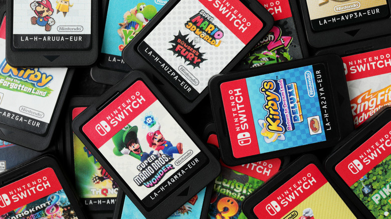 An assortment of Nintendo Switch games laying in a pile with one another