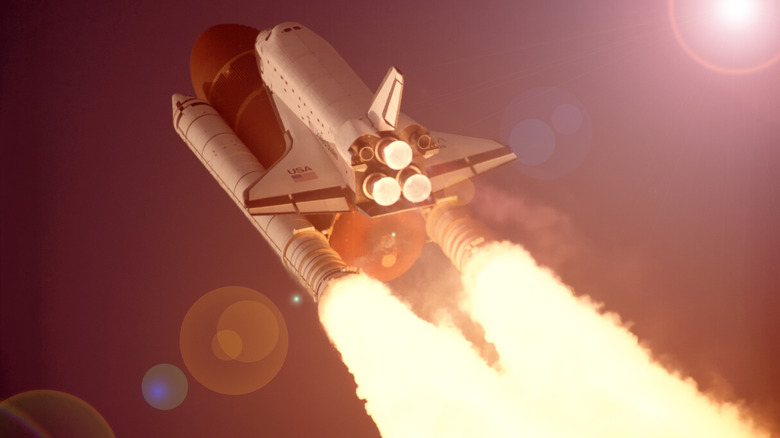 Space Shuttle launching with RS-25 liquid fueled engines and solid rocket boosters