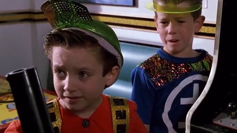 Still of Elijah Wood as video game kid and John Thornton from Back to the Future Part II.