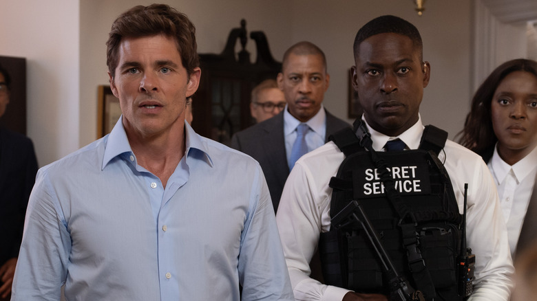 James Marsden and Sterling K. Brown in a bulletproof vest stood next to each other in Paradise