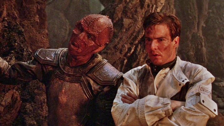 Drac and Davidge standing next to each other and staring at something