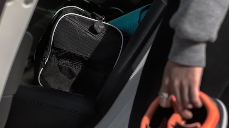 Cube Tracker attached to the side of a bag zipper