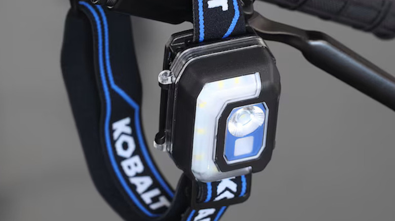 Kobalt headlamp attached to the side of a bike handle