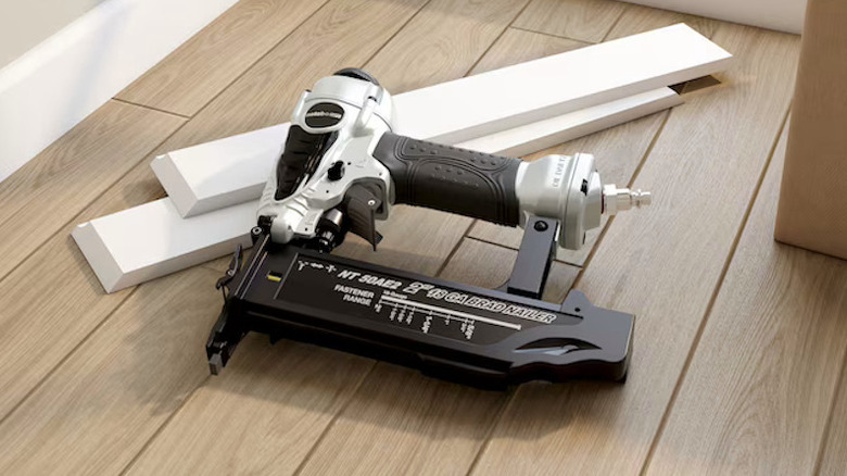 Metabo Straight Brad Nailer on the ground next to a wood floor