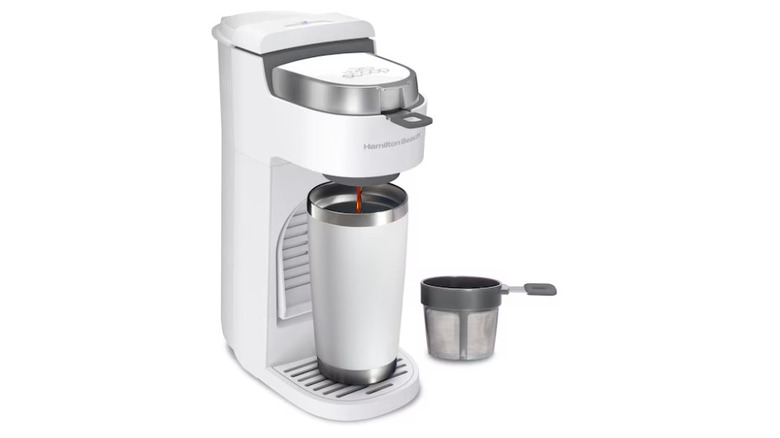 Single-Serve Coffee Machine from Hamilton Beach with coffee being poured into a thermos