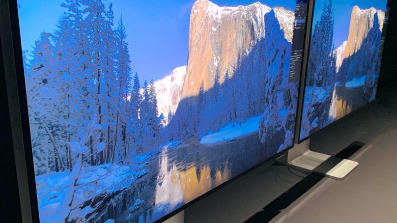 Pro Display XDR monitors kept next to each other