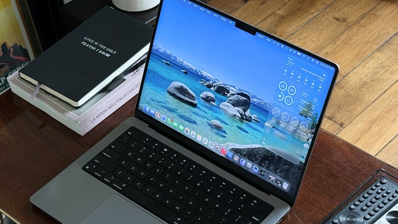 macOS Tahoe new Liquid Glass design running on MacBook Pro