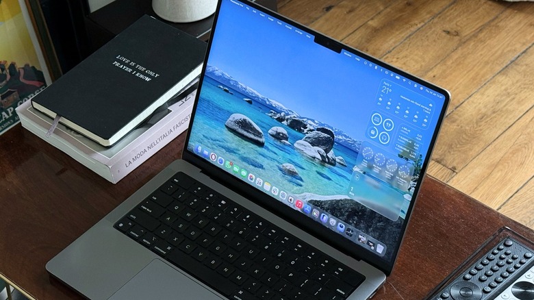 macOS Tahoe new Liquid Glass design running on MacBook Pro