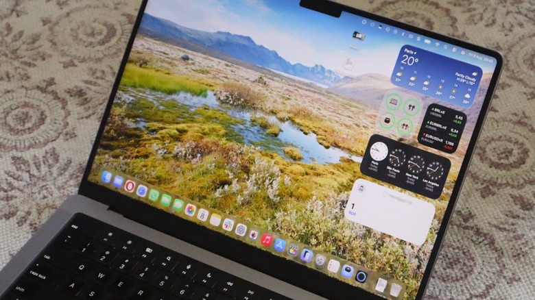 macOS Tahoe new Liquid Glass design running on MacBook Pro