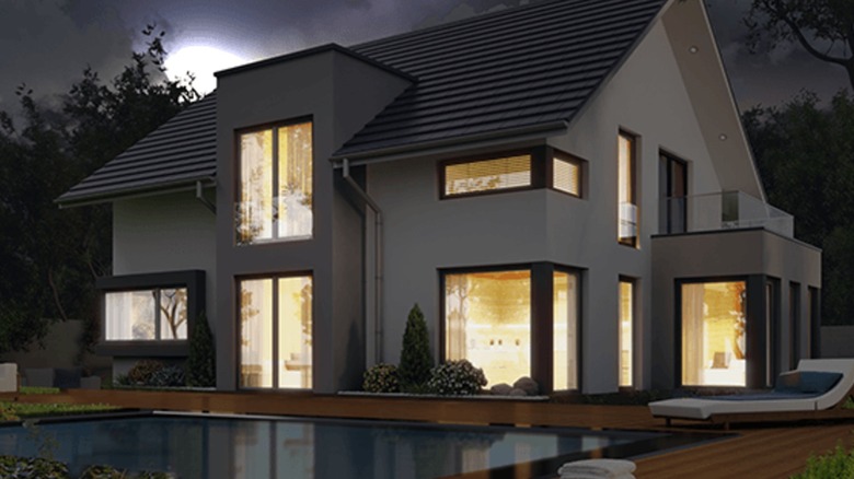 Exterior view of house with interior illuminated by Roku smart bulbs