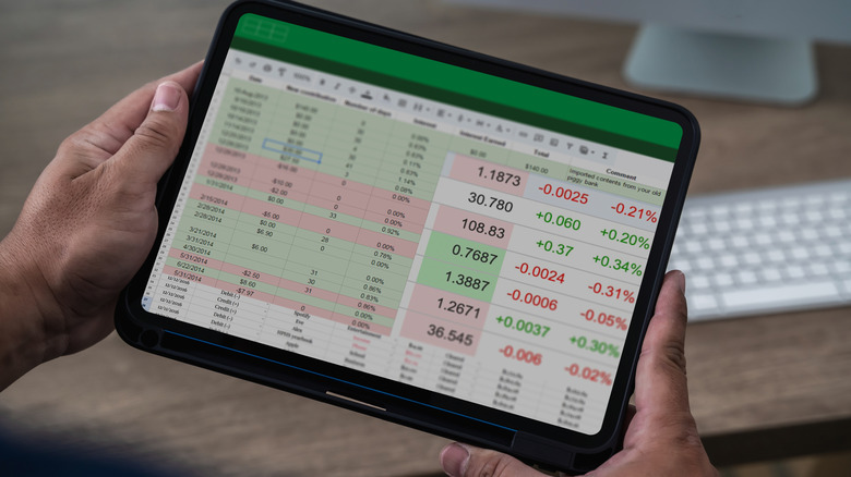 Person viewing Spreadsheet on tablet