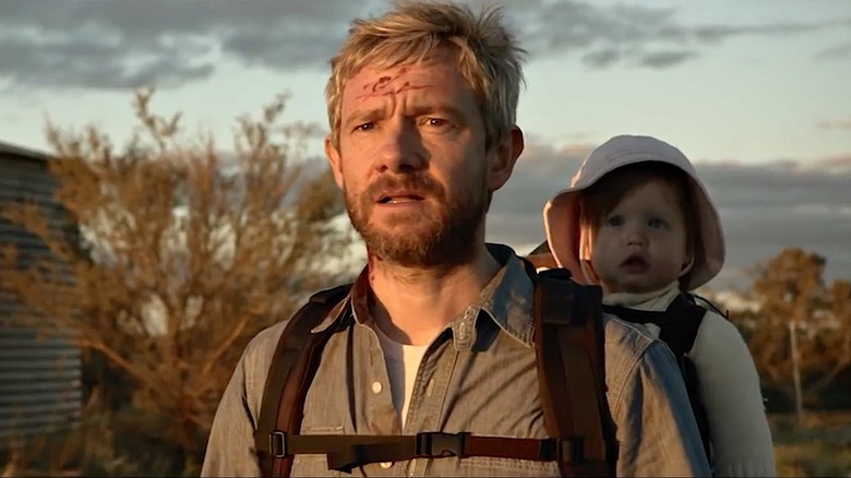 Andy (Martin Freeman) with a baby on his back in 
