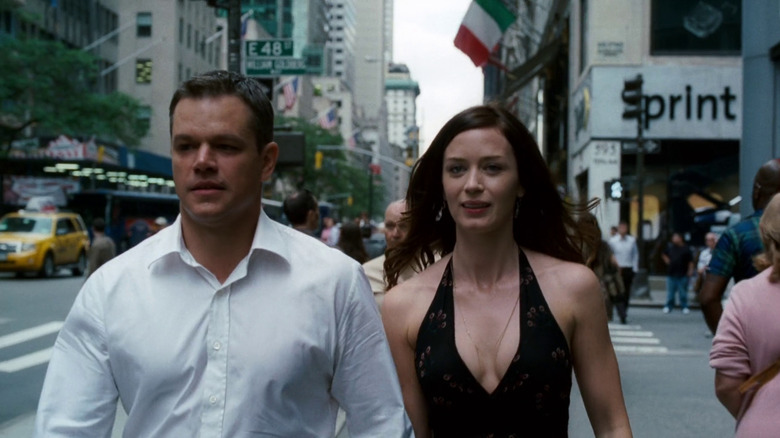 David and Elise smiling while walking on the street