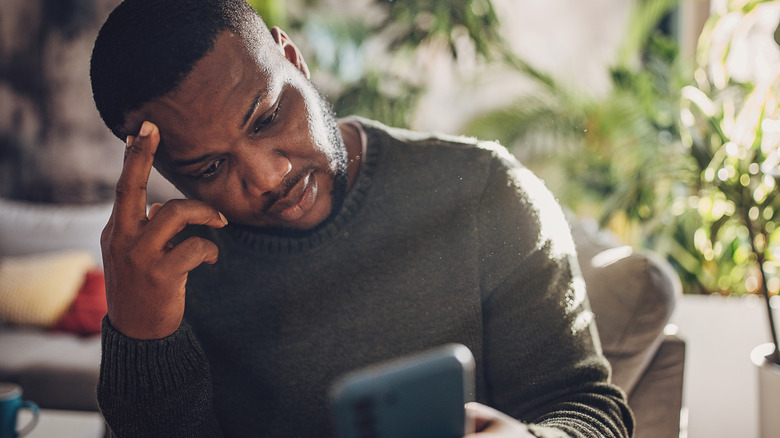 man upset with his phone