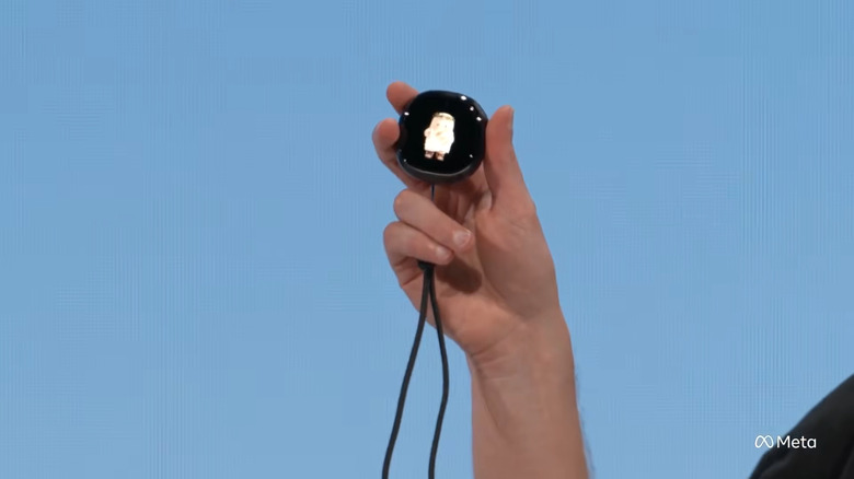 Zoomed-in view of Meta CEO Mark Zuckerberg holding a Muse Charm in his hand at Connect 2026