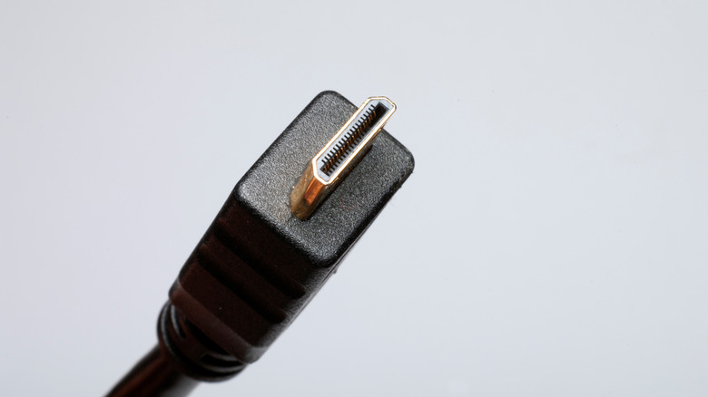 A Micro HDMI cable connector against a light gray background