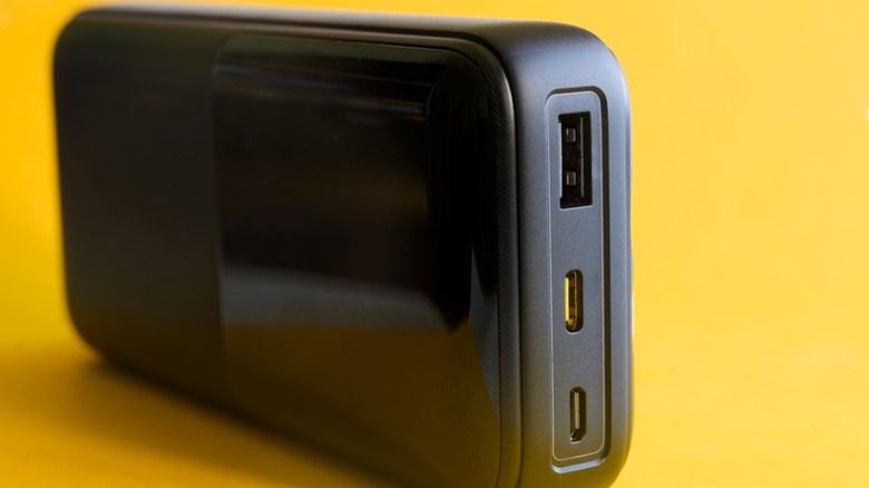 A power bank featuring a USB Type-A port, a USB-C port, and a Micro-USB port all side-by-side.