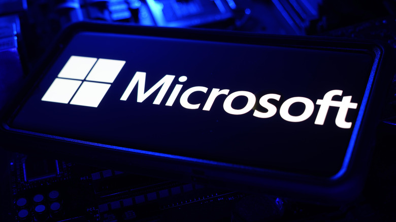 The Microsoft logo on a screen sitting atop computer parts