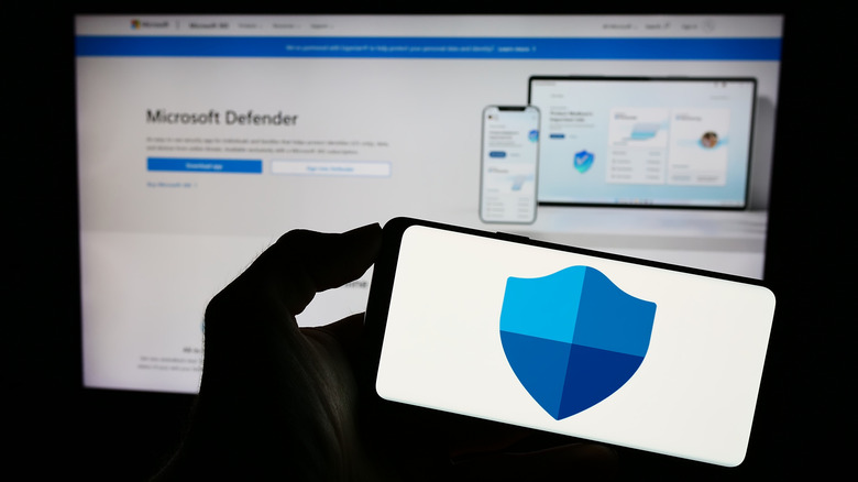 A Microsoft Defender logo on a smartphone.