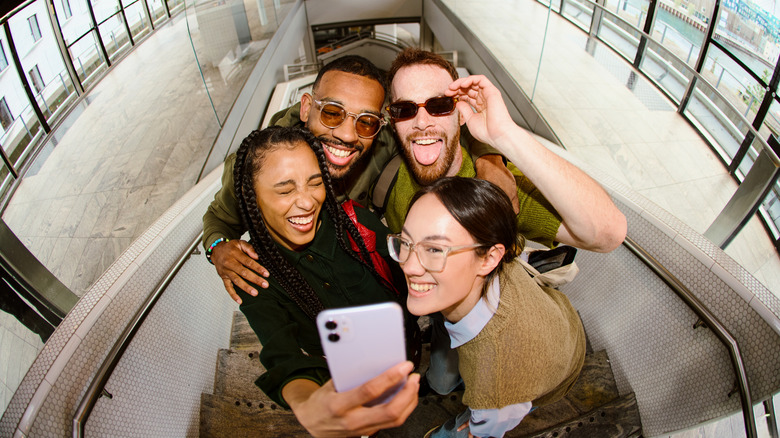 A group of friends take a selfie together