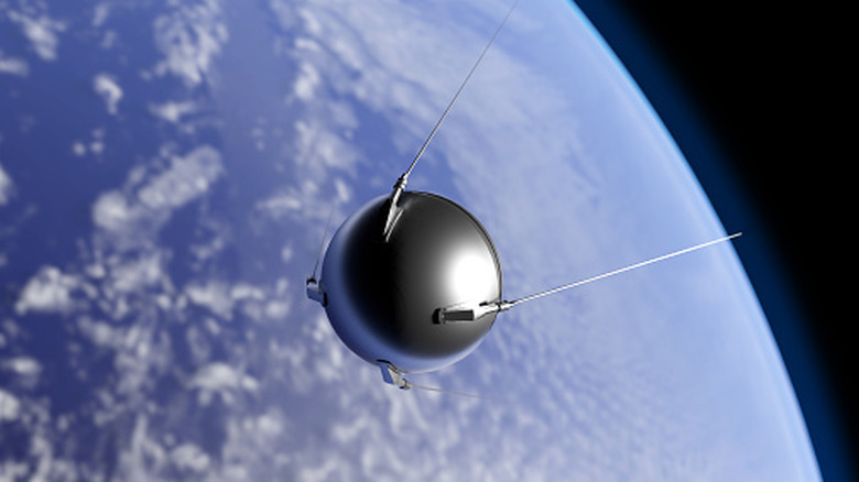 The Sputnik satellite in space with earth in the background