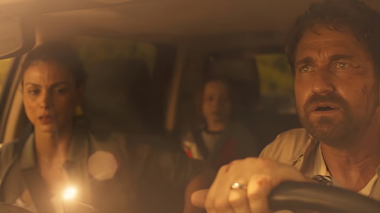 John (Gerard Butler) and Allison (Morena Baccarin) sitting in a car in 