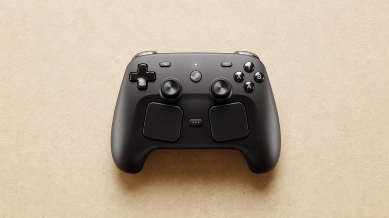The Valve Steam Controller seen from directly above on a neutral surface