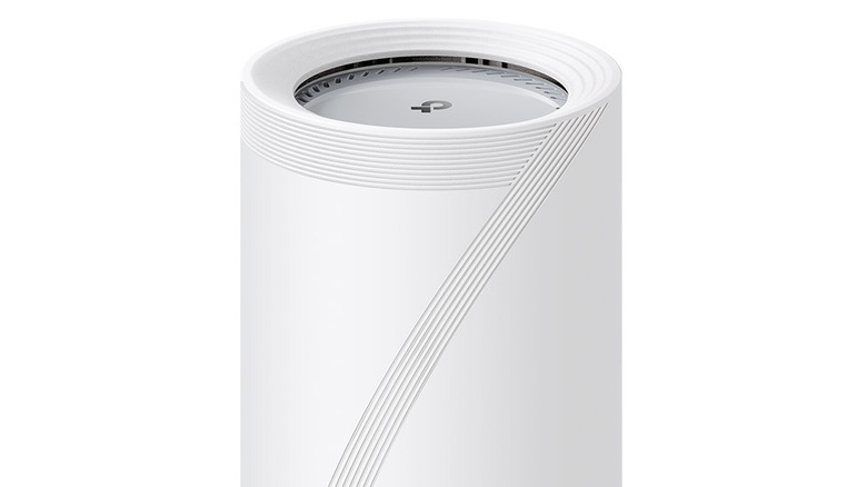 TP-Link Deco BE65 Pro mesh router in a white cylindrical design against a neutral background.