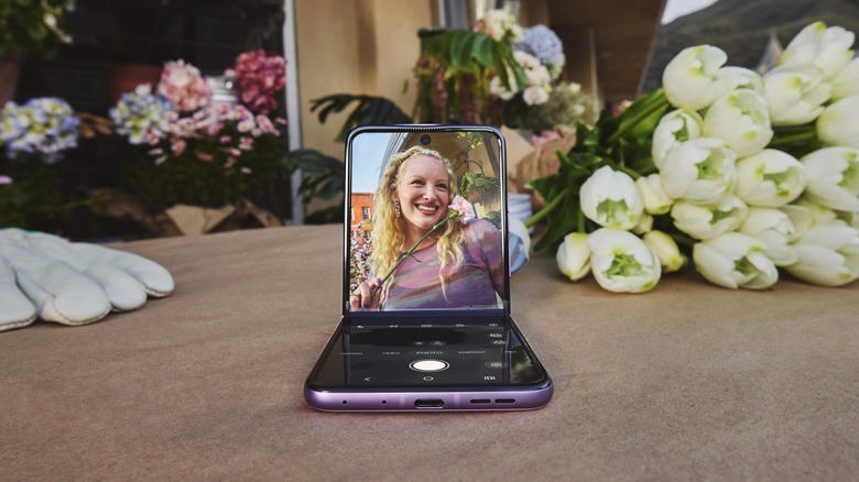 The Motorla Razr+ (2026) unfolded on a table, with the camera app open.