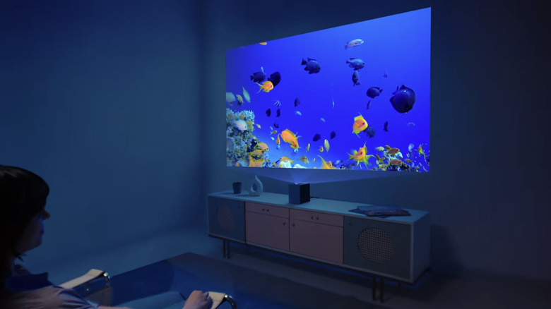 LG's CineBeam S projector beaming an image onto a wall.