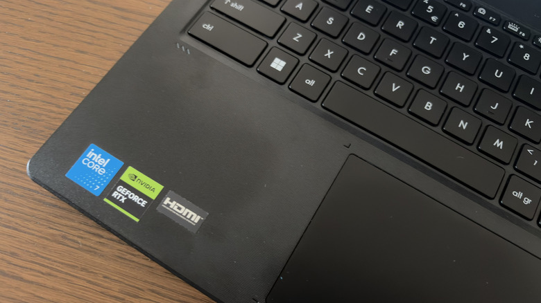 Close-up showing the keyboard and badge stickers on the MSI Cyborg 15