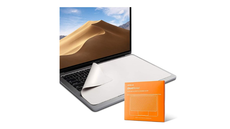 An open MacBook with a microfiber lining on the keyboard