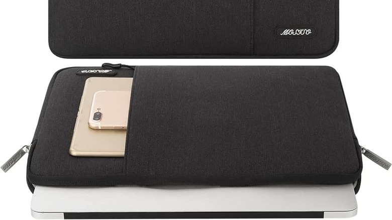 A black colored protective sleeve for a MacBook