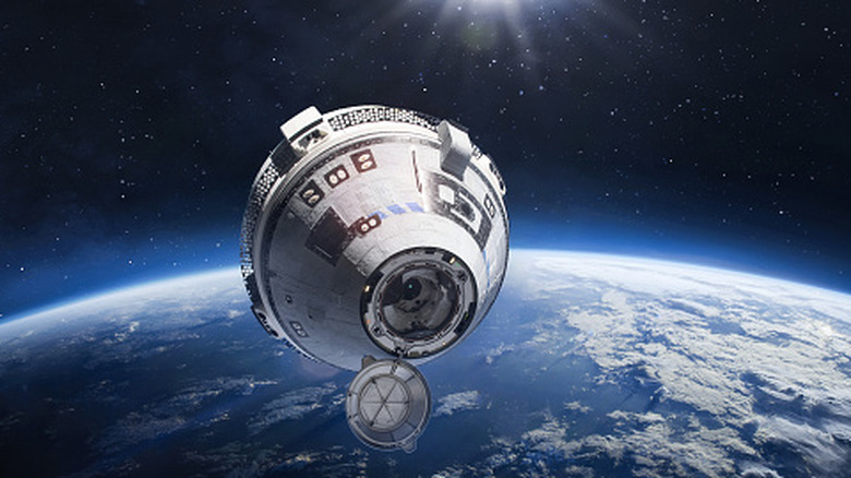 starliner concept, floating in space above earth